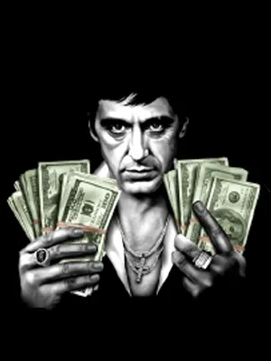 Al Pacino como Tony Montana con fajos de billetes en El precio del poder