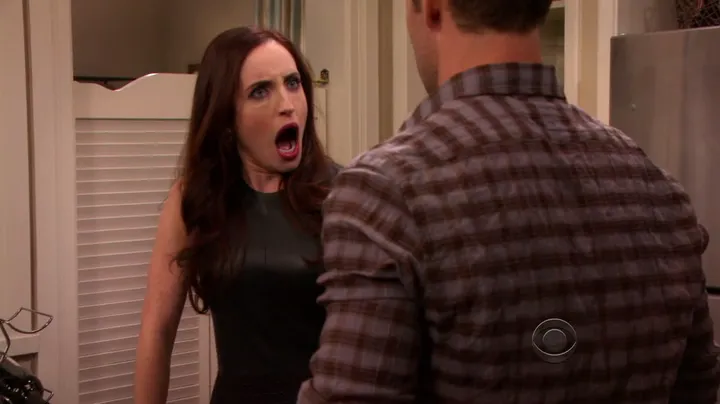 Una mujer con la boca abierta de asombro frente a un hombre en Friends with Better Lives